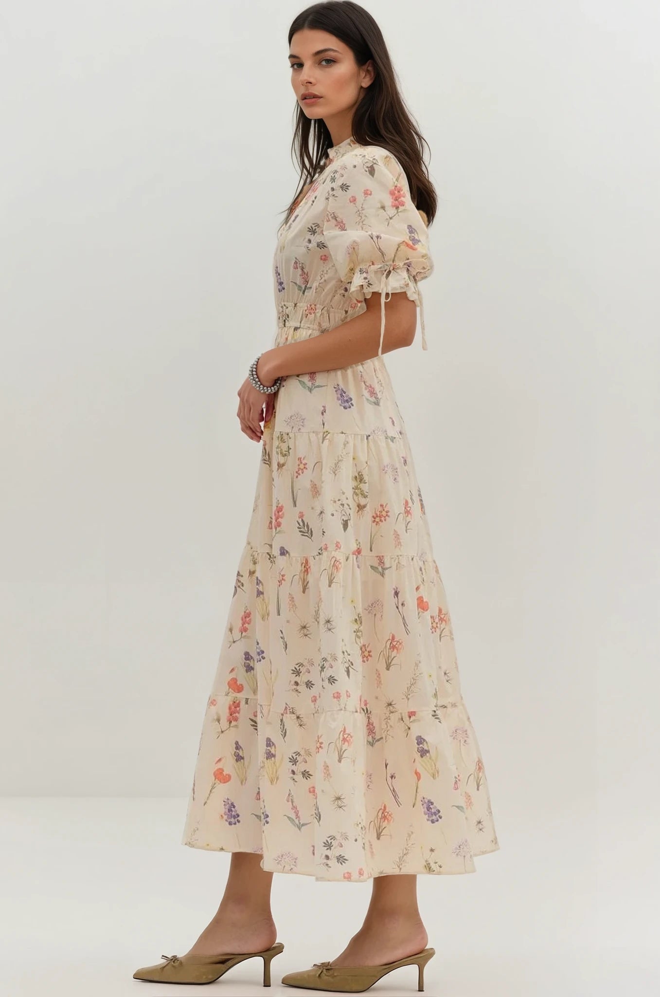 Woman wearing a floral dress on a white background